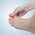 hand pressing on big toe